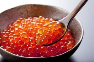 red caviar on spoon