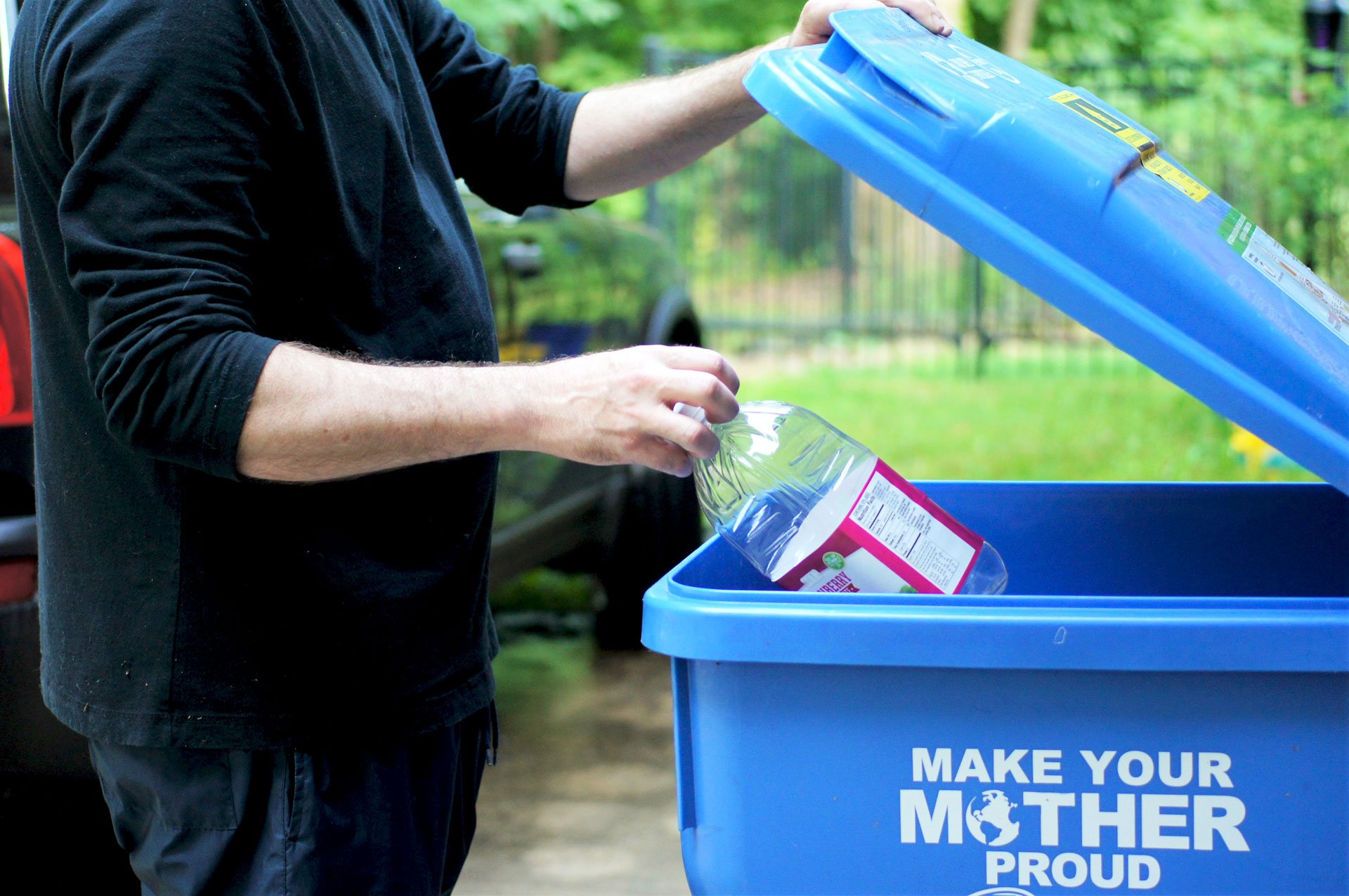 Man recycling plastic bottle