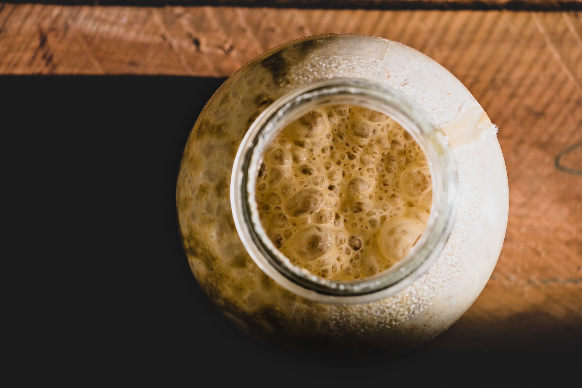 sourdough starter in a jar seen from overhead