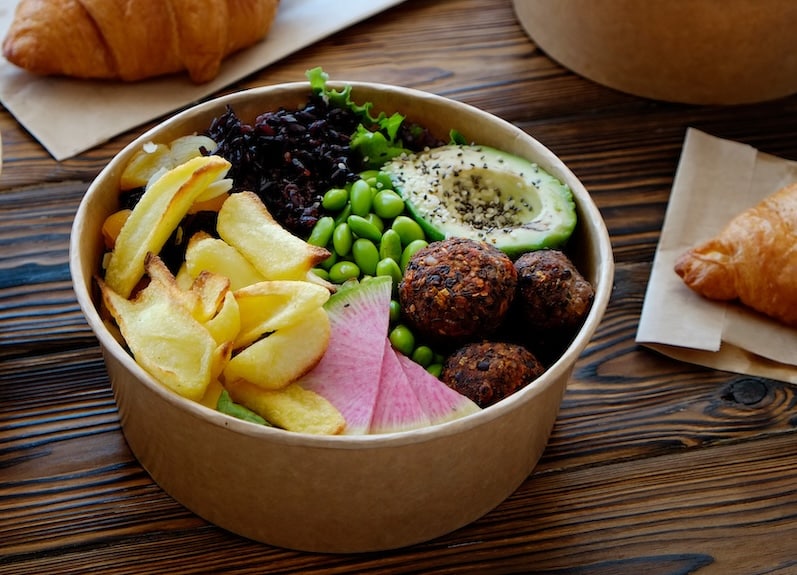 Takeout food in a cardboard box with PFAS lined interior